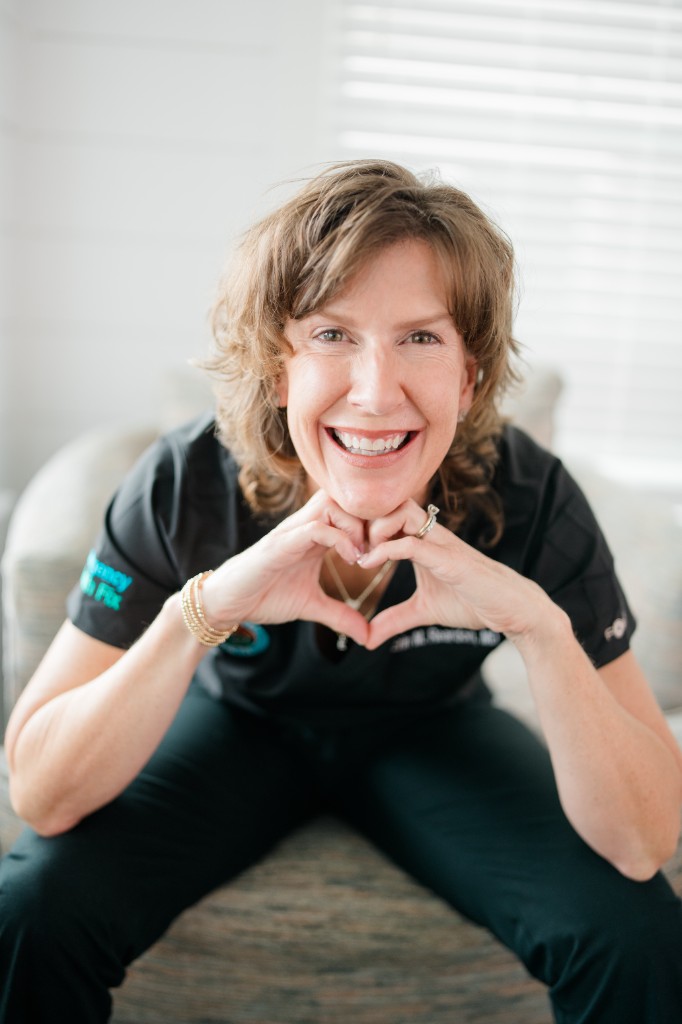 Dr. Erin making a heart with her hands